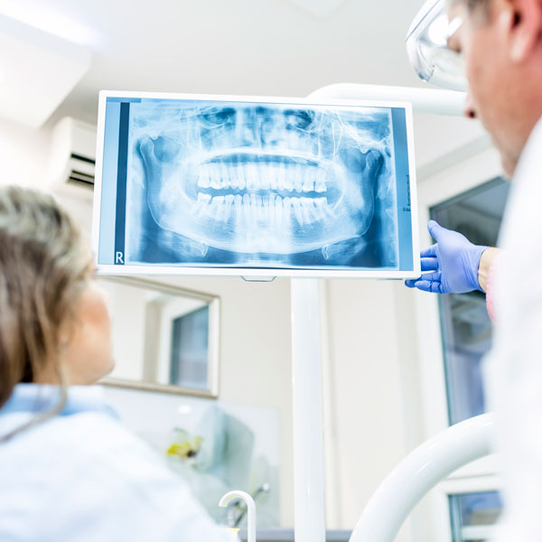 doctor and patient looking at x-ray