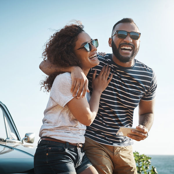 smiling adult couple outdoors