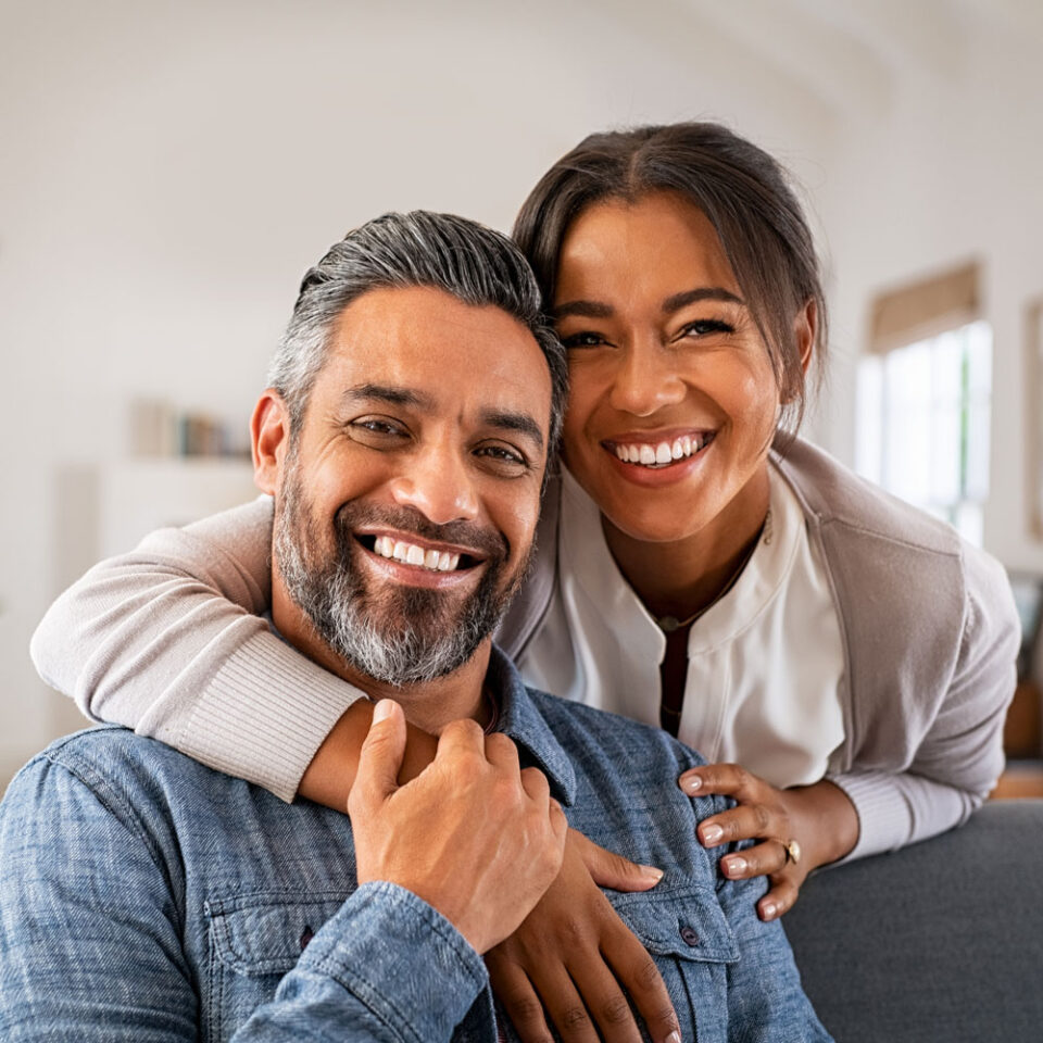 smiling couple in home