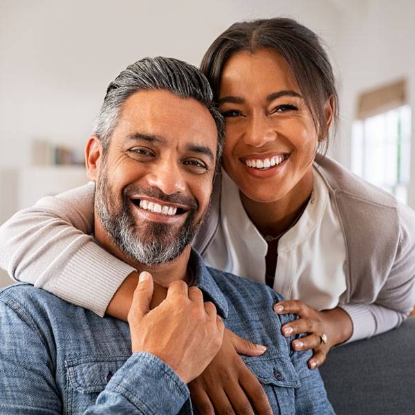 smiling couple in home
