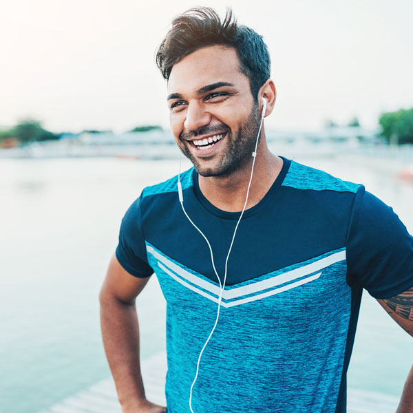 adult man on jog smiling
